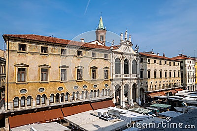 A view of the market in Piazza dei Signori with the facade of Palazzo di Monte di PietÃ  behind, Vicenza Editorial Stock Photo